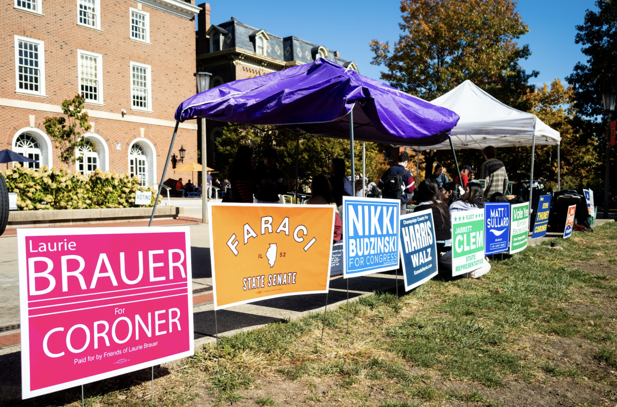 Candidate signs in front of the Illini Union on Oct. 24 encouraging eligible students to vote.